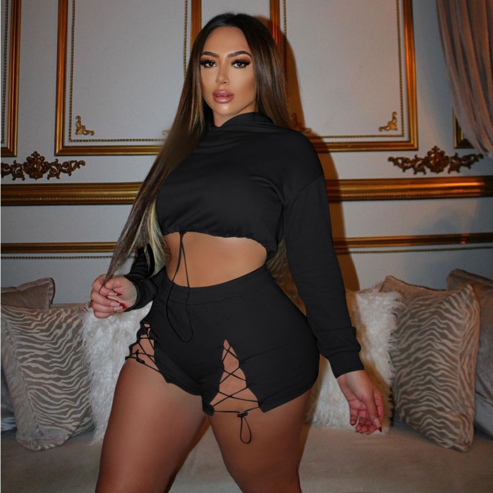Black two piece crop top with shorts.
